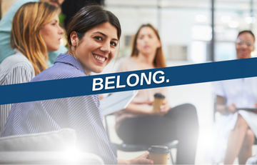 An image of people at a meeting with a purple banner that says "Belong."