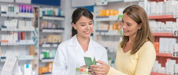Pharmacist talking to a customer