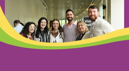 A gathering of people at HOPA 2025 with a New Orleans swirl border