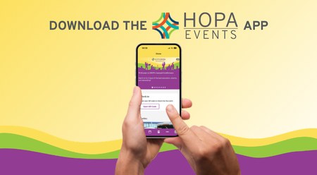 An image of hands with a cell phone accessing the HOPA Events app