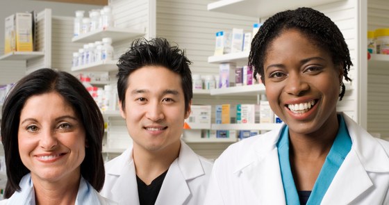 A photo of three pharamcists smiling