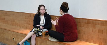 Two hem/onc pharmacists in conversation