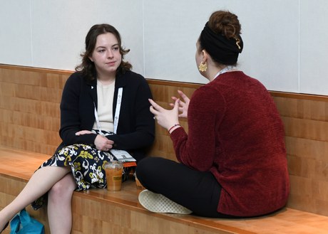 Two hem/onc pharmacists in conversation