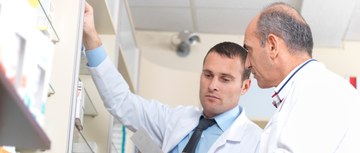 Pharmacists talking and looking serious