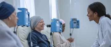 An oncology pharmacist helping a patient