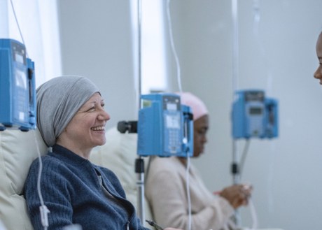 An oncology pharmacist helping a patient