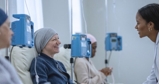 An oncology pharmacist helping a patient