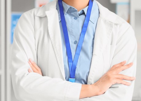 A pharmacist in a white coat
