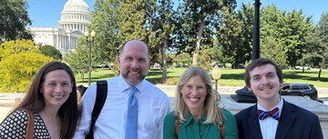 A photo of several HOPA members posing in front of the Capitol
