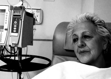black and white photo of woman of color receiving IV chemo