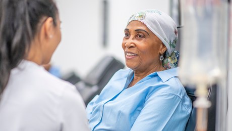 A cancer patient talking with her doctor