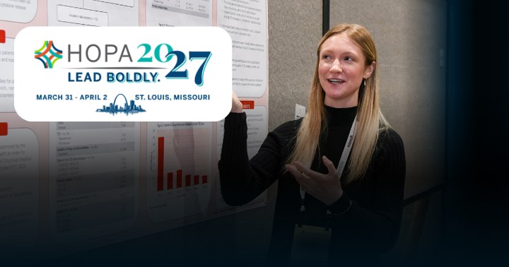 A person presenting an abstract at Annual Conference with the HOPA 2027 logo
