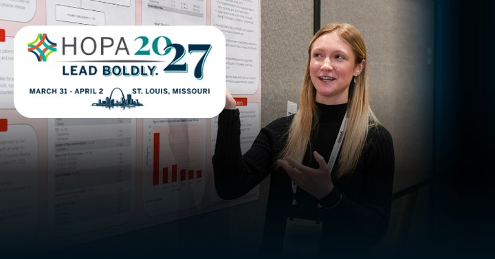 A person presenting an abstract at Annual Conference with the HOPA 2027 logo